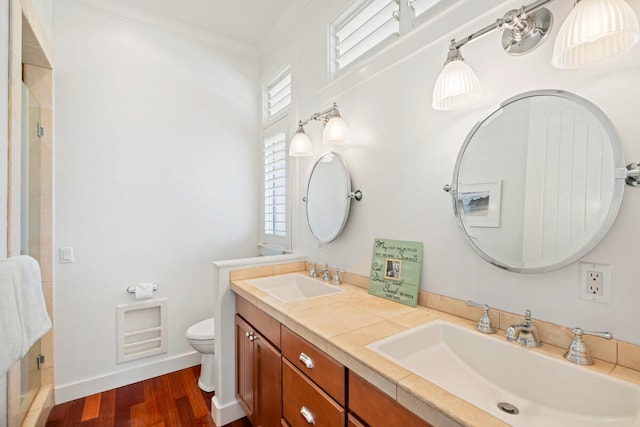 3042 Lauae Pl, Koloa, HI 96756 - full bath with double vanity, toilet, a shower stall, ornamental molding, and wood finished floors