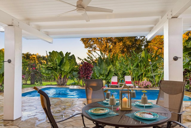 3042 Lauae Pl, Koloa, HI 96756 - swimming pool featuring a ceiling fan, a patio area, and outdoor dining space