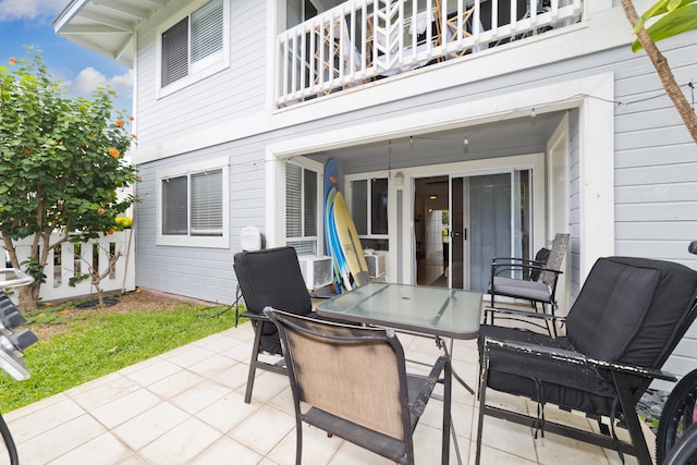 75-6081 Alii Dr Unit D104, Kailua-Kona, HI 96740 - view of patio with a balcony and outdoor dining space