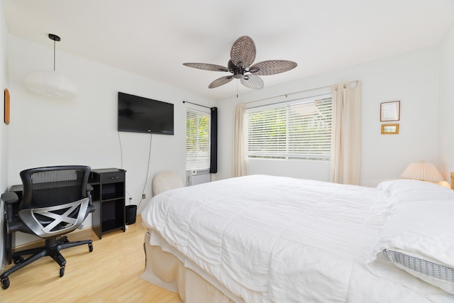 75-6081 Alii Dr Unit D104, Kailua-Kona, HI 96740 - bedroom featuring light wood-type flooring and a ceiling fan