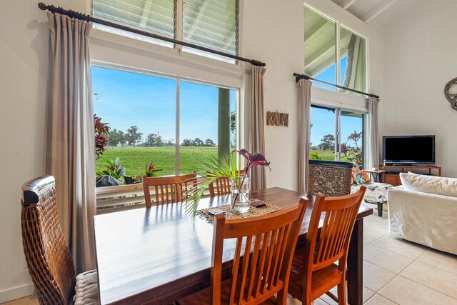 3880 Wyllie Rd Unit 12B, Princeville, HI 96722 - dining room featuring a towering ceiling and light tile patterned floors