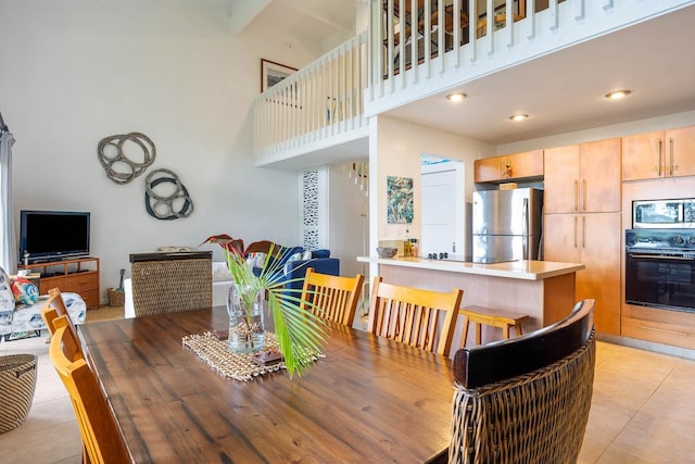 3880 Wyllie Rd Unit 12B, Princeville, HI 96722 - dining space with a high ceiling and light tile patterned flooring