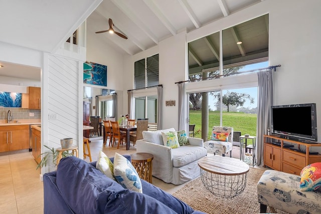 3880 Wyllie Rd Unit 12B, Princeville, HI 96722 - living area featuring high vaulted ceiling, beamed ceiling, ceiling fan, and light tile patterned floors