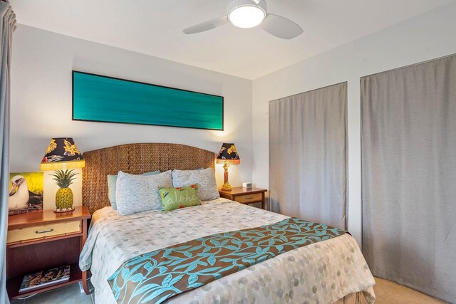 3880 Wyllie Rd Unit 12B, Princeville, HI 96722 - bedroom featuring a ceiling fan and tile patterned flooring