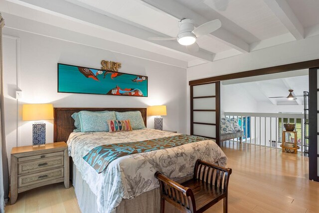 3880 Wyllie Rd Unit 12B, Princeville, HI 96722 - bedroom with beam ceiling, wood finished floors, and a ceiling fan