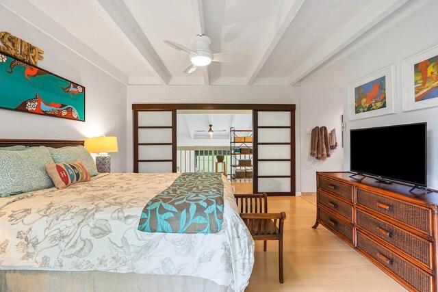 3880 Wyllie Rd Unit 12B, Princeville, HI 96722 - bedroom with beamed ceiling and light wood-style floors