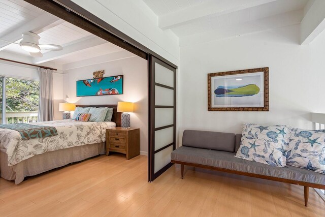 3880 Wyllie Rd Unit 12B, Princeville, HI 96722 - bedroom featuring light wood-style flooring, a ceiling fan, and wooden ceiling with exposed beams