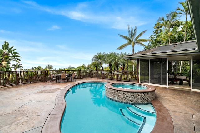 74-4967 Kiwi St, Kailua-Kona, HI 96740 - view of pool with a pool with connected hot tub, outdoor dining area, a patio area, and a sunroom