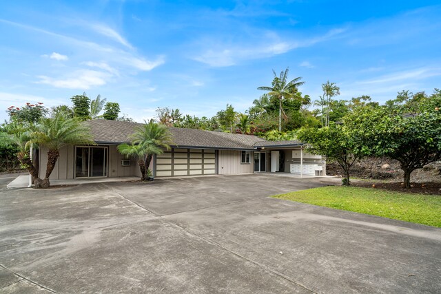 74-4967 Kiwi St, Kailua-Kona, HI 96740 - ranch-style home with an attached garage, concrete driveway, and a shingled roof