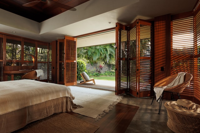5-1105 Kuhio Hwy Unit A, Kilauea, HI 96754 - bedroom with access to outside, concrete floors, and wood ceiling