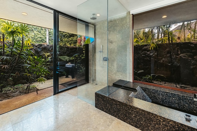5-1105 Kuhio Hwy Unit A, Kilauea, HI 96754 - bathroom featuring floor to ceiling windows, a shower, and recessed lighting