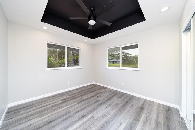 15-1987 27th Ave, Keaau, HI 96749 - spare room featuring a tray ceiling, wood finished floors, a ceiling fan, and recessed lighting