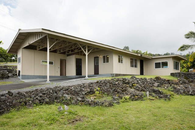 73-1361 Kaukahoku Rd, Kailua-Kona, HI 96740 - rear view of property with a carport, driveway, and a patio