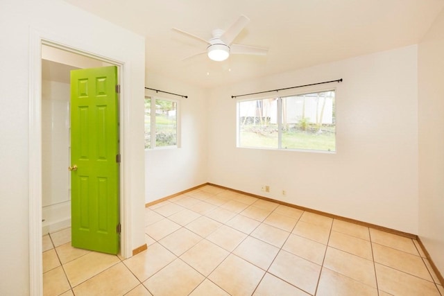 73-1361 Kaukahoku Rd, Kailua-Kona, HI 96740 - spare room featuring light tile patterned floors, baseboards, and a ceiling fan
