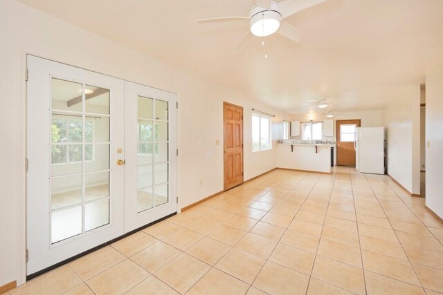 73-1361 Kaukahoku Rd, Kailua-Kona, HI 96740 - unfurnished room with french doors, ceiling fan, light tile patterned flooring, and baseboards