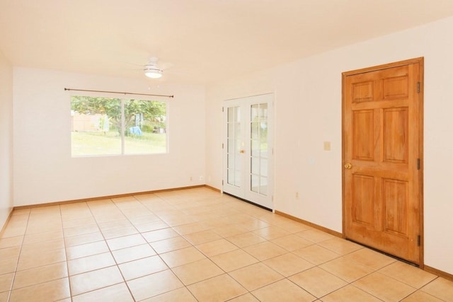 73-1361 Kaukahoku Rd, Kailua-Kona, HI 96740 - spare room featuring baseboards, ceiling fan, and light tile patterned floors