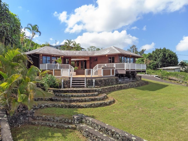 72-981 Puukala Rd, Kailua-Kona, HI 96740 - back of property featuring a lawn, stairway, and a deck
