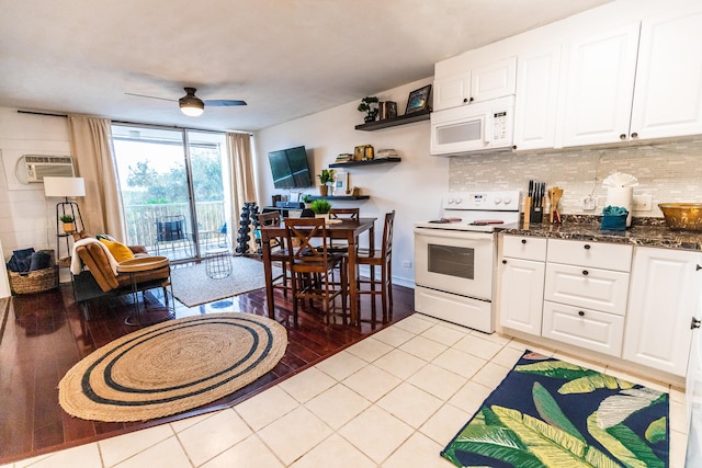 75-5766 Kuakini Hwy Unit 207, Kailua-Kona, HI 96740 - kitchen featuring white appliances, tasteful backsplash, a ceiling fan, white cabinetry, and an AC wall unit