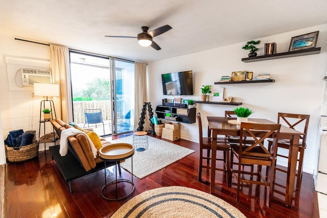 75-5766 Kuakini Hwy Unit 207, Kailua-Kona, HI 96740 - living area featuring a ceiling fan, hardwood / wood-style flooring, a wall mounted air conditioner, and baseboards