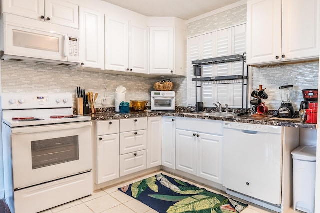 75-5766 Kuakini Hwy Unit 207, Kailua-Kona, HI 96740 - kitchen with white appliances, a sink, white cabinetry, light tile patterned flooring, and backsplash