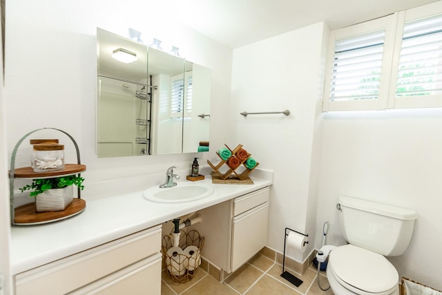 75-5766 Kuakini Hwy Unit 207, Kailua-Kona, HI 96740 - full bath with vanity, tile patterned floors, healthy amount of natural light, and toilet