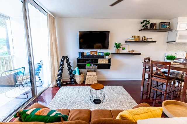 75-5766 Kuakini Hwy Unit 207, Kailua-Kona, HI 96740 - living room featuring healthy amount of natural light, wood finished floors, baseboards, and ceiling fan