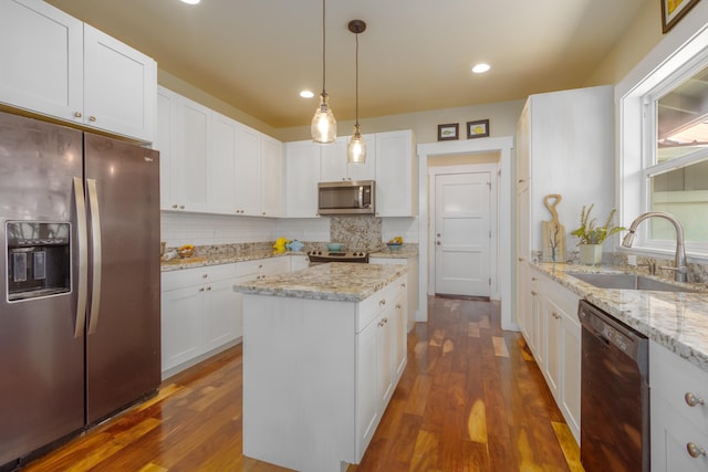 54-3723 Lehuula Cir, Kapaau, HI 96755 - kitchen featuring appliances with stainless steel finishes, a sink, decorative backsplash, a center island, and dark wood finished floors