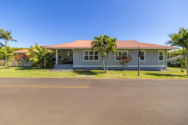 54-3723 Lehuula Cir, Kapaau, HI 96755 - ranch-style home with board and batten siding, covered porch, a front yard, and metal roof