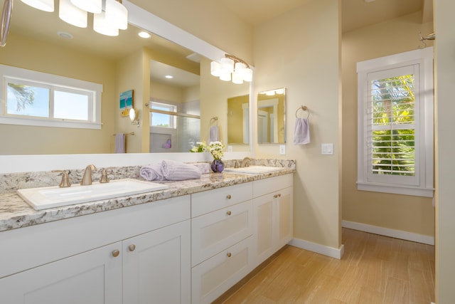 54-3723 Lehuula Cir, Kapaau, HI 96755 - bathroom featuring double vanity, wood finished floors, a stall shower, and baseboards