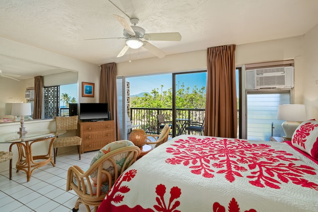 5061 Lawai Rd Unit 333, Koloa, HI 96756 - bedroom with access to exterior, light tile patterned floors, a wall mounted AC, and ceiling fan