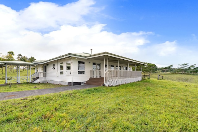 28-811 Akaka Falls Rd, Honomu, HI 96728 - view of front facade with a front yard and a porch