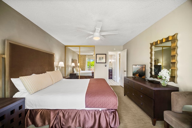 525 Aleka Lp Unit C13, Kapaa, HI 96746 - bedroom with a textured ceiling, carpet floors, a ceiling fan, and a closet