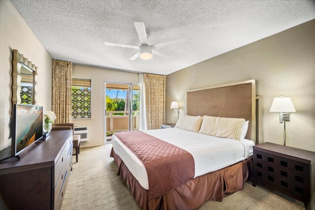 525 Aleka Lp Unit C13, Kapaa, HI 96746 - bedroom featuring access to exterior, light colored carpet, a ceiling fan, and a textured ceiling