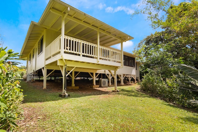 4085-B Noho Rd, Koloa, HI 96756 - rear view of house featuring a lawn, a wooden deck, and ac unit