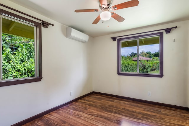 4085-B Noho Rd, Koloa, HI 96756 - spare room featuring a wall mounted air conditioner, healthy amount of natural light, dark wood-style flooring, and baseboards
