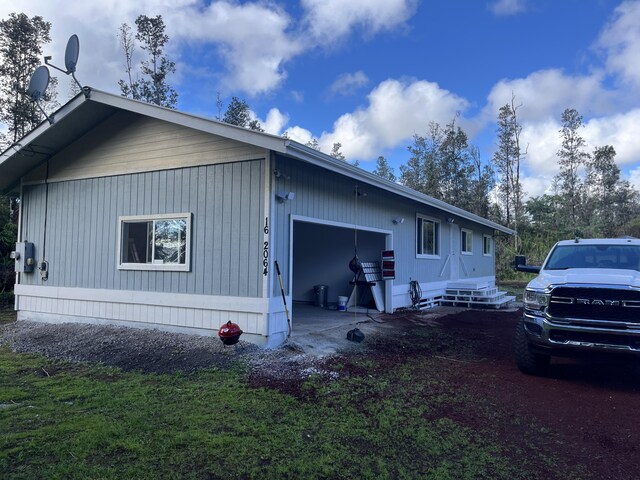 16-2064 Azure Dr, Pahoa, HI 96778 - view of side of property featuring an attached garage