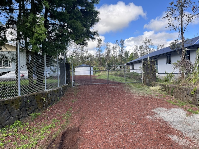 16-2064 Azure Dr, Pahoa, HI 96778 - view of yard with driveway and a gate