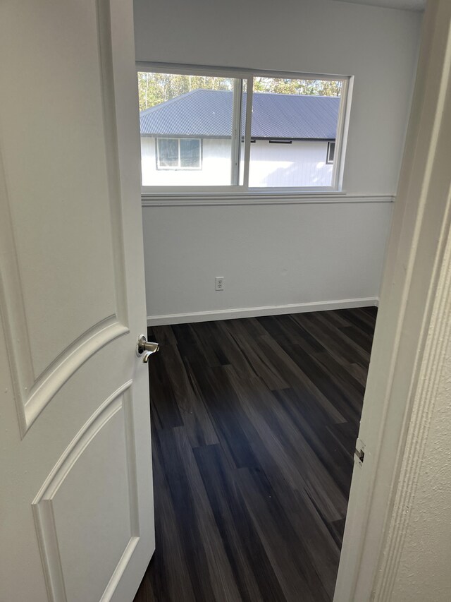 16-2064 Azure Dr, Pahoa, HI 96778 - spare room featuring dark wood-type flooring and baseboards