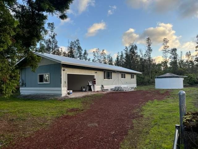 16-2064 Azure Dr, Pahoa, HI 96778 - back of house featuring an outbuilding, driveway, and a garage