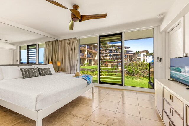 1661 Pee Rd Unit I-204, Koloa, HI 96756 - bedroom featuring light tile patterned floors, a ceiling fan, and access to outside