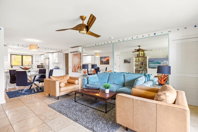 1661 Pee Rd Unit I-204, Koloa, HI 96756 - living room featuring a wall mounted air conditioner, ceiling fan, and light tile patterned flooring