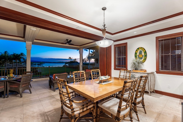 69-1000 Kolea Kai Cir Unit 7E, Waikoloa, HI 96738 - dining area with ornamental molding, baseboards, a ceiling fan, a raised ceiling, and a water view