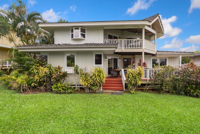 4194 Waileia Pl, Princeville, HI 96722 - back of house with a balcony, a lawn, a tile roof, ceiling fan, and a deck