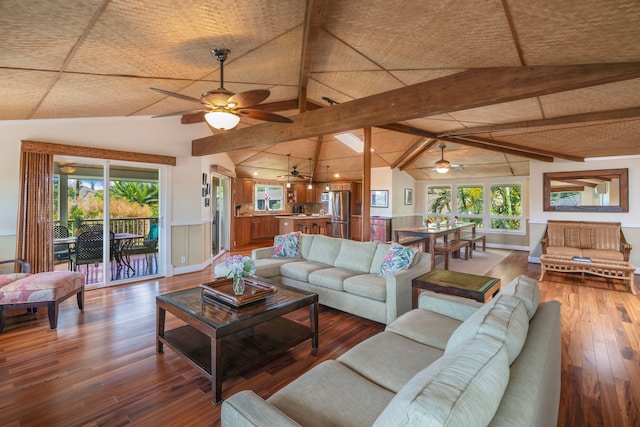 4194 Waileia Pl, Princeville, HI 96722 - living room featuring a ceiling fan, healthy amount of natural light, wood finished floors, and a wainscoted wall