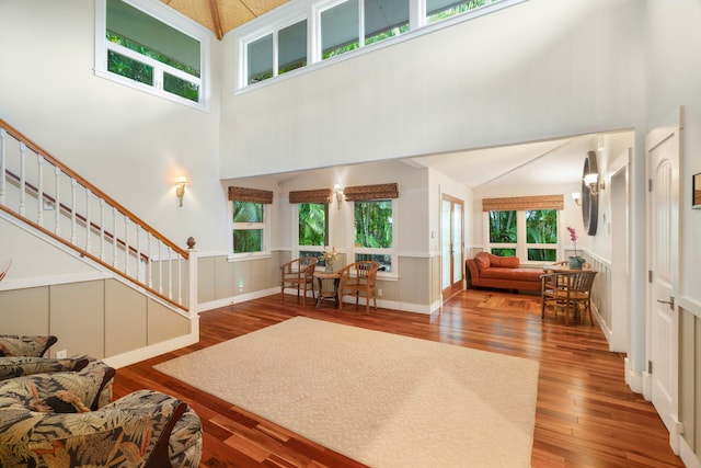 4194 Waileia Pl, Princeville, HI 96722 - living area with a towering ceiling, wood finished floors, and stairway