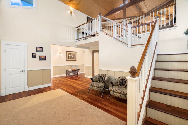 4194 Waileia Pl, Princeville, HI 96722 - stairway with wood finished floors, a high ceiling, and wainscoting