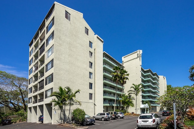 1875 Kalanianaole Ave Unit 409, Hilo, HI 96720 - view of apartment building / complex with uncovered parking