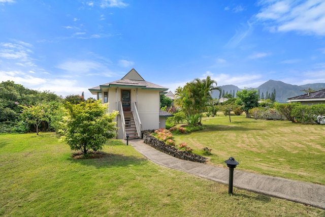 5451 Ka Haku Rd Unit 24, Princeville, HI 96722 - view of green lawn featuring a mountain view and stairway