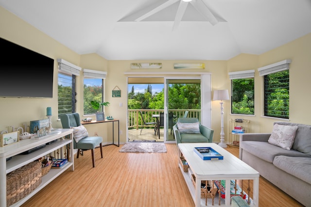 5451 Ka Haku Rd Unit 24, Princeville, HI 96722 - living area featuring vaulted ceiling, healthy amount of natural light, wood finished floors, and ceiling fan