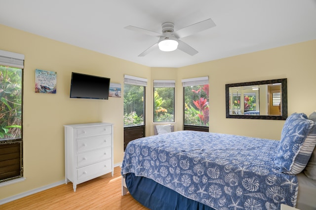 5451 Ka Haku Rd Unit 24, Princeville, HI 96722 - bedroom featuring wood finished floors, baseboards, and ceiling fan